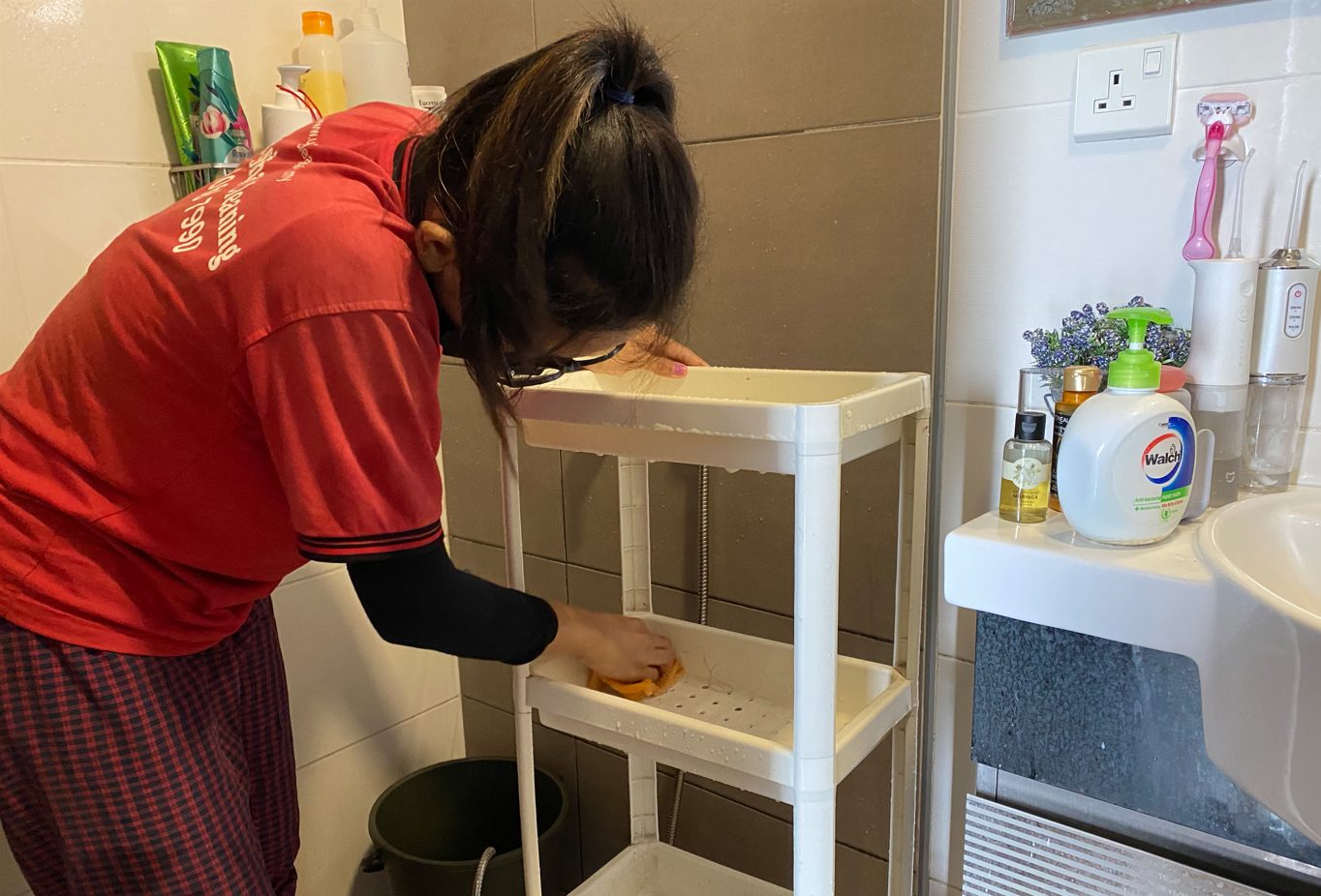 Ultra Cleaning specialist detailing a bathroom shelf in Petaling Jaya