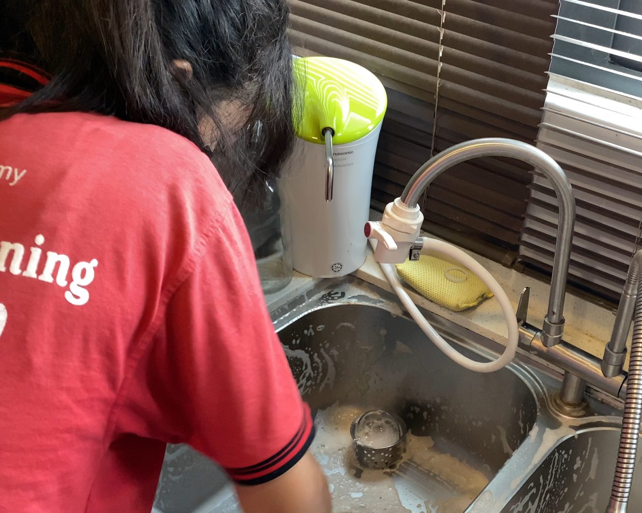 Ultra Cleaning specialist scrubbing a kitchen sink in a Petaling Jaya home